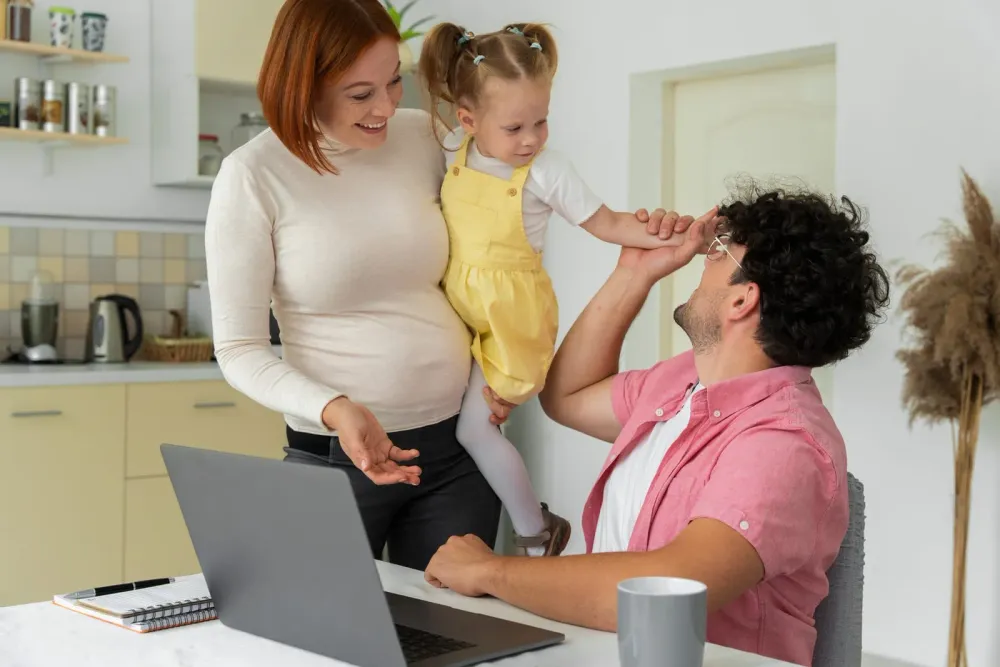 A parent and two children together at home